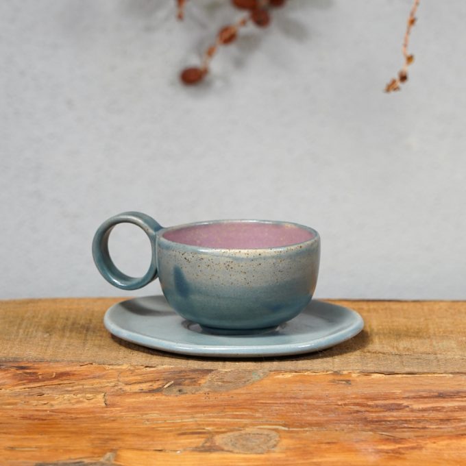 Double coloured espresso cup with saucer