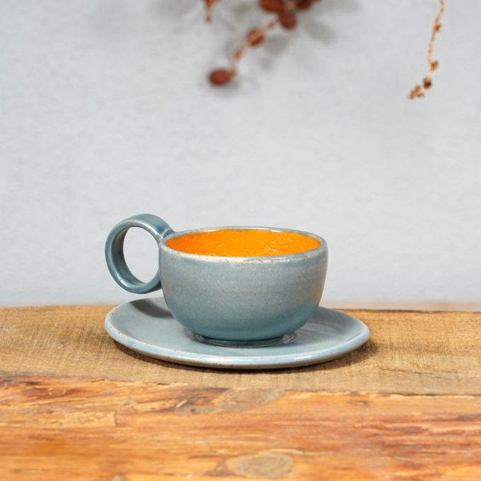 Double coloured espresso cup with saucer