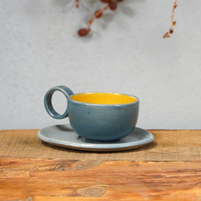 Double coloured espresso cup with saucer