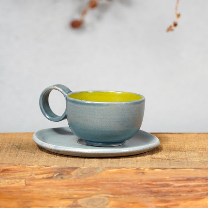 Double coloured espresso cup with saucer
