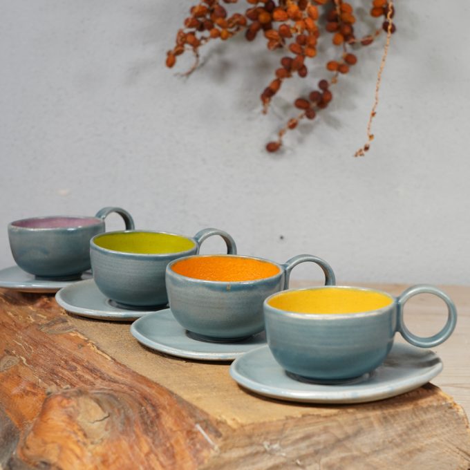 Double coloured espresso cup with saucer