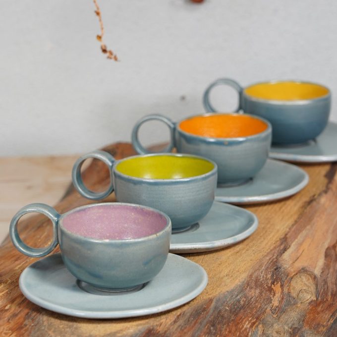 Double coloured espresso cup with saucer
