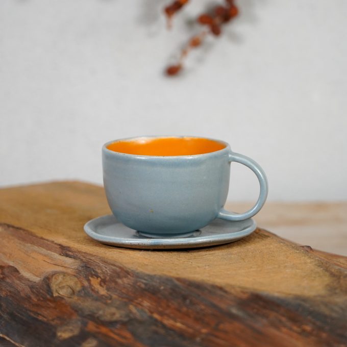 Double coloured cappuccino mug with saucer