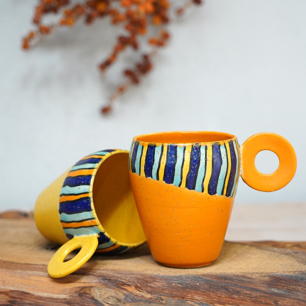 handmade ceramic mug with colorful stripes