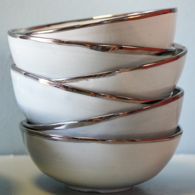 Handmade porcelain bowl with silver