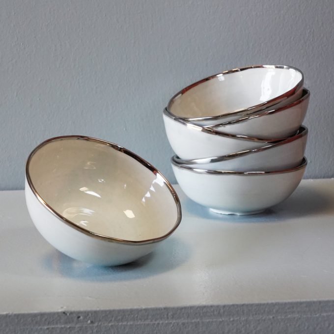Handmade porcelain bowl with silver