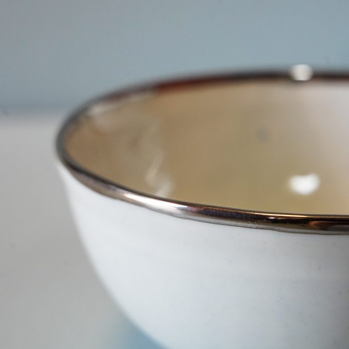 Handmade porcelain bowl with silver