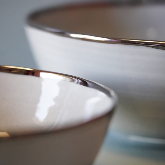 Handmade porcelain bowl with silver