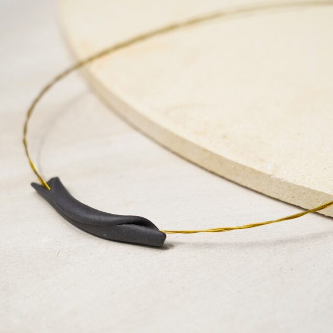 sculpted matte black ceramic curve wire necklace