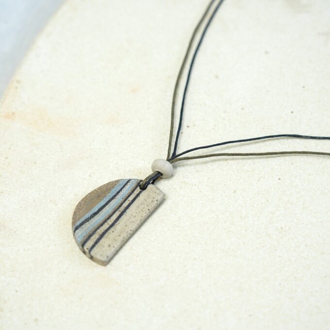 curved striped ceramic fragment waxthread necklace