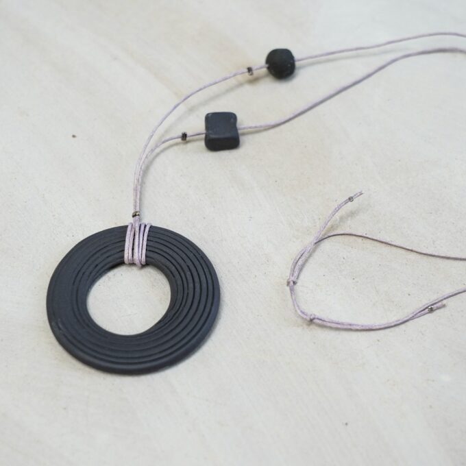 waxthread necklace with grooved matte black ceramic ring