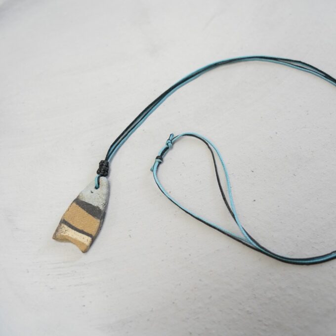 waxthread necklace with narrow layered ceramic fragment