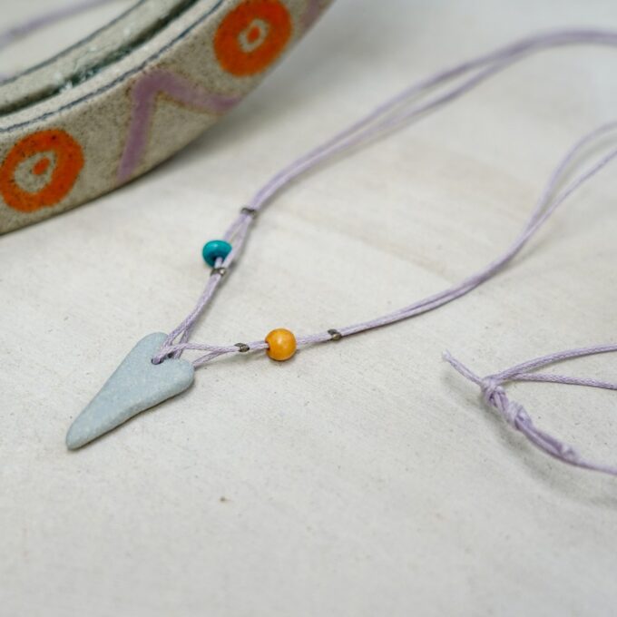 waxthread necklace with soft blue tapered ceramic element