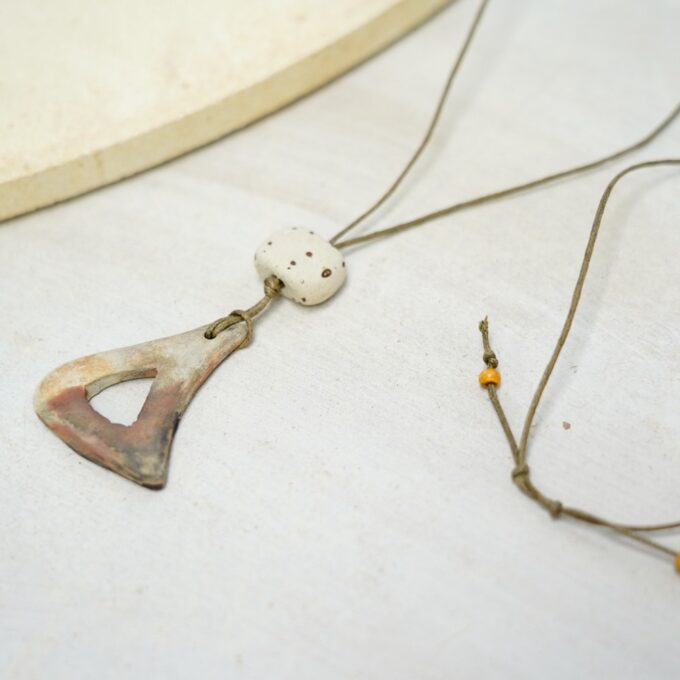 waxthread necklace with speckled ceramic bead and open triangle