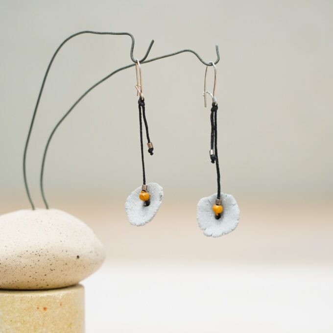 waxthread earrings with flat ceramic disc elements