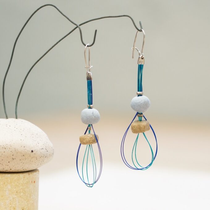 triple bead ceramic wire earrings with layered blue wire