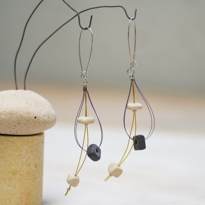 wire earrings with layered ceramic beads and curved shape