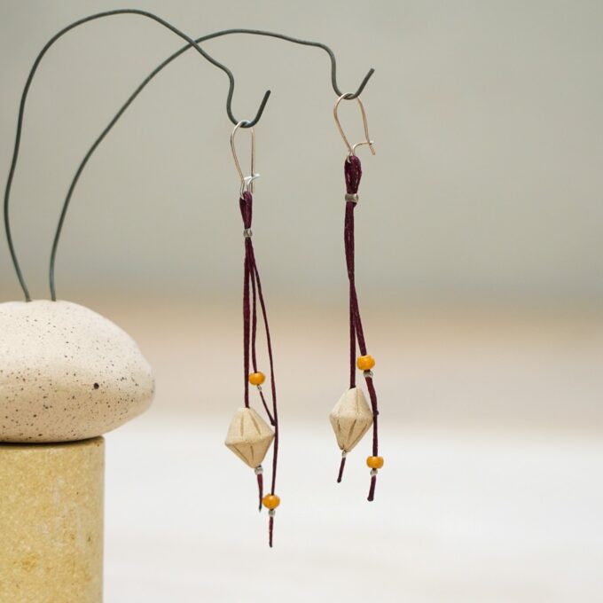 waxthread earrings with faceted handmade ceramic elements