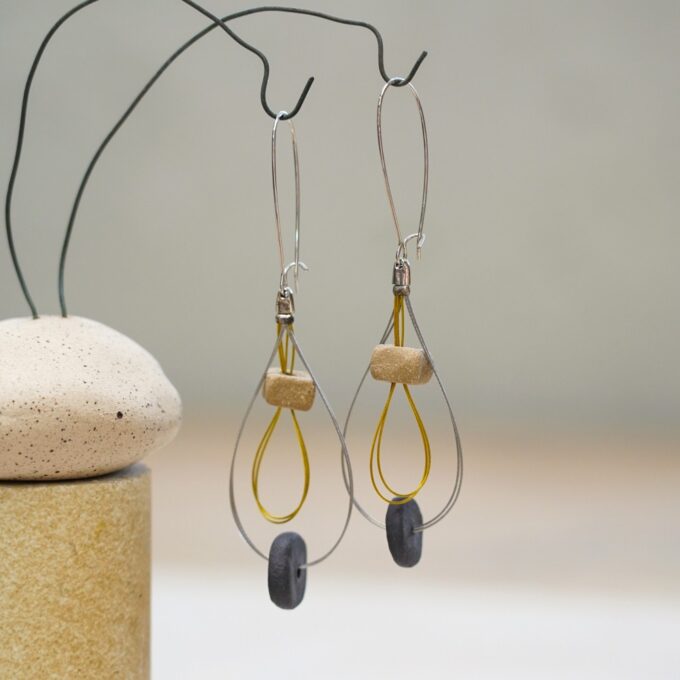 wire earrings with layered ceramic beads and teardrop form