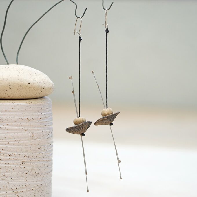 wire earrings with ceramic discs and vertical metal rods