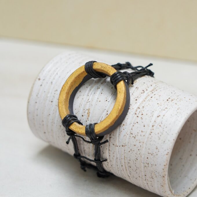 waxthread bracelet with handmade gold coated porcelain ring element