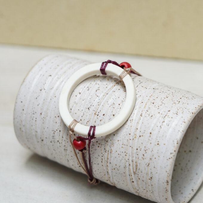 unique waxthread bracelet with handmade white porcelain loop element and subtle colour accents