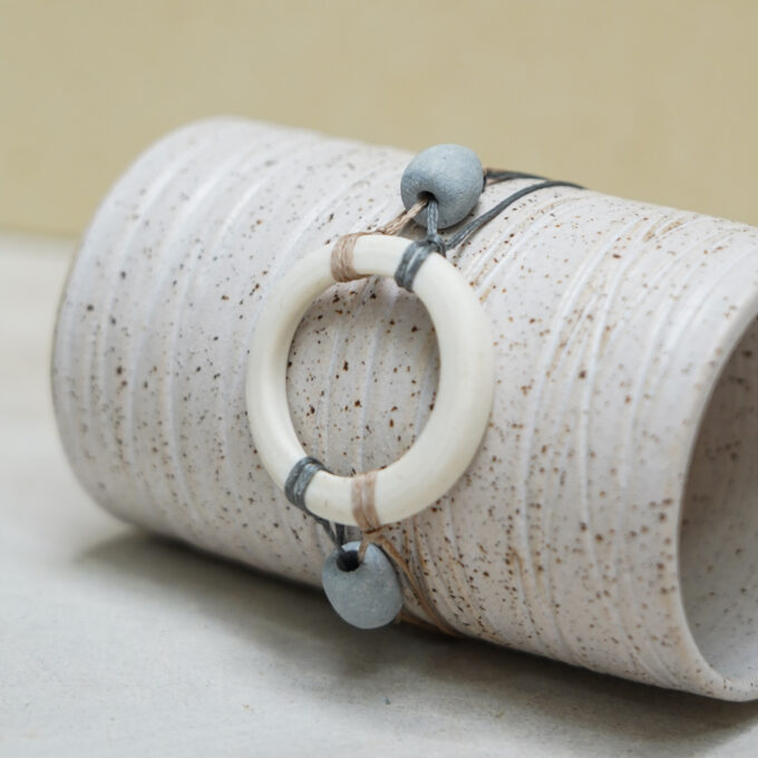 waxthread bracelet with handmade white porcelain ring and grey porcelain beads