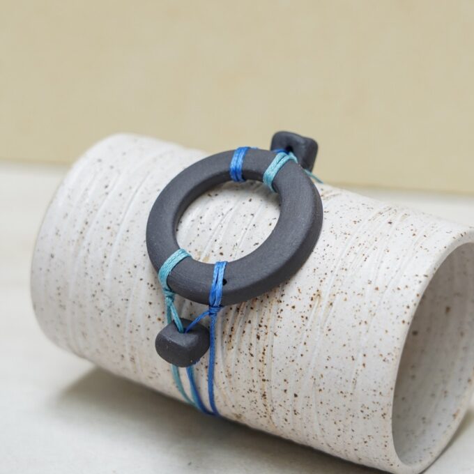 waxthread bracelet with handmade black porcelain ring and black porcelain bead