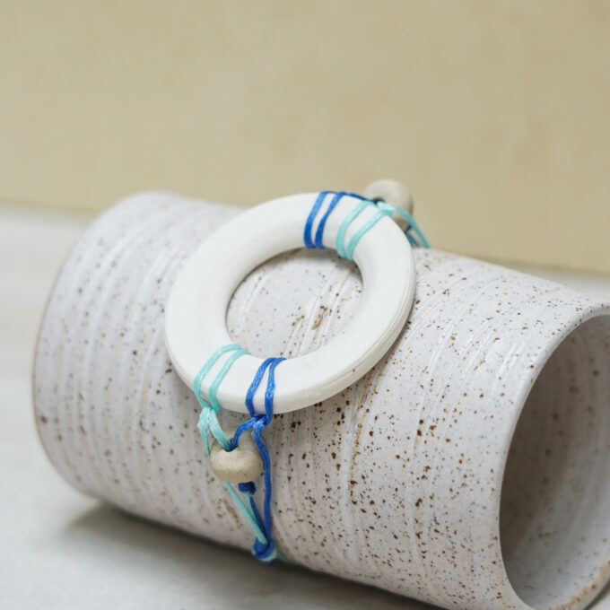 waxthread bracelet with handmade white porcelain ring and white bead