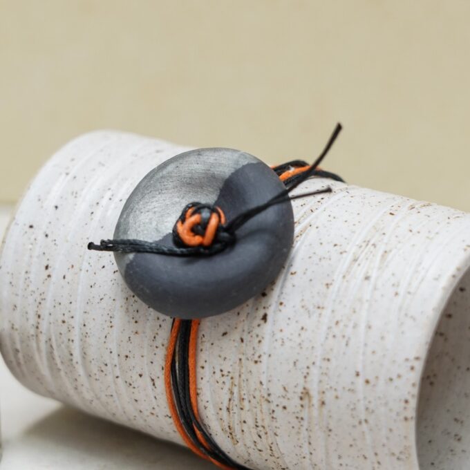 waxthread bracelet with silver-coated black porcelain button