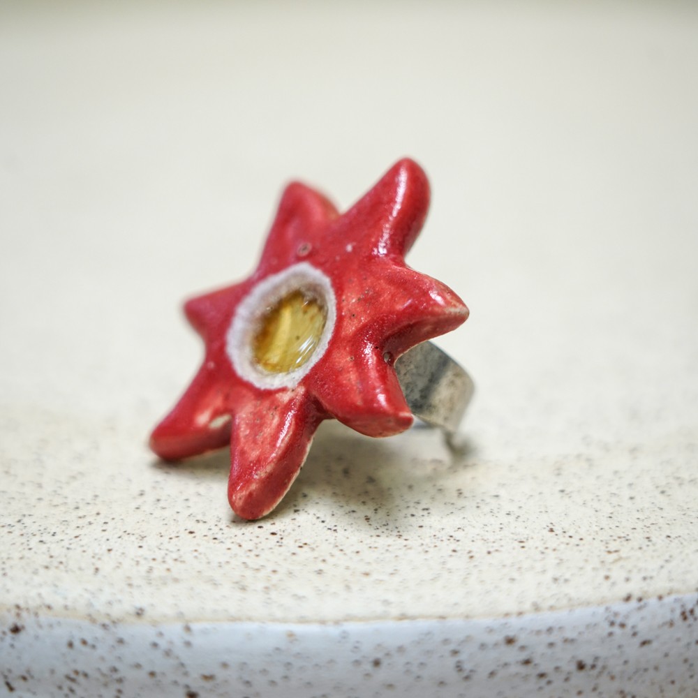 ceramic star-shaped ring with red glaze