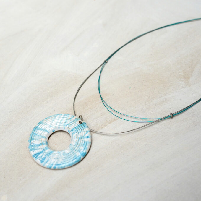 jewelry wire pendant with textured circular ceramic element