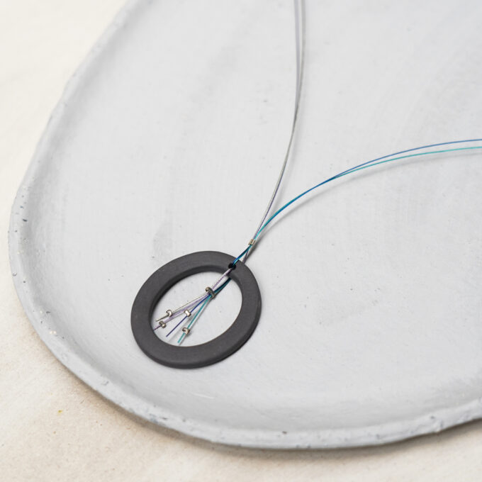 black ceramic circular necklace