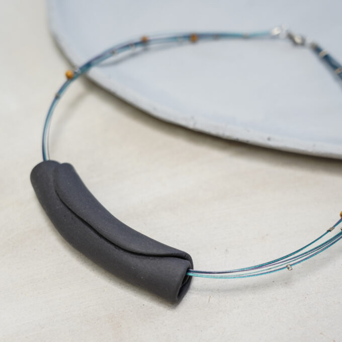 folded matte black ceramic tube wire necklace