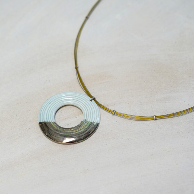 light blue ceramic ring wire necklace with metallic accent