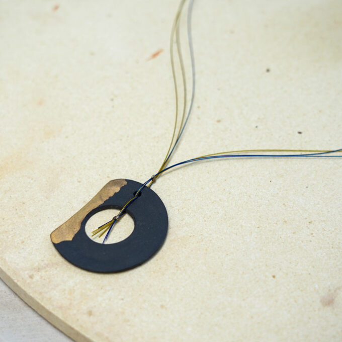 minimal wire necklace with gold ceramic detail