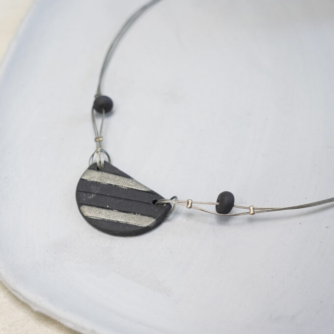 black ceramic disc wire necklace with silver accents